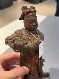 A Chinese gilt-lacquered bronze offering figure on stand, Ming