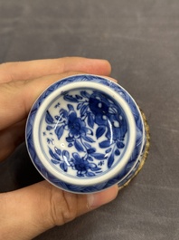 A Chinese blue and white goblet, a salt and a vase, Kangxi