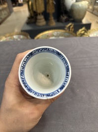 A Chinese blue and white goblet, a salt and a vase, Kangxi