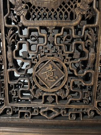 Four Chinese carved and openworked wooden doors, early 20th C.