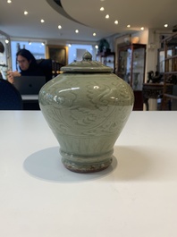 Two Chinese Longquan celadon jars with floral design, Ming