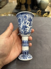 A Chinese blue and white goblet, a salt and a vase, Kangxi