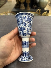 A Chinese blue and white goblet, a salt and a vase, Kangxi