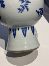 A Chinese blue and white pear-shaped vase with floral design, Transitional period