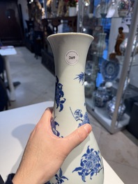 A Chinese blue and white pear-shaped vase with floral design, Transitional period