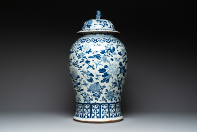 A large Chinese blue and white 'birds among blossoming branches' vase and cover, 19th C.