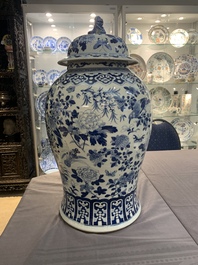 A large Chinese blue and white 'birds among blossoming branches' vase and cover, 19th C.