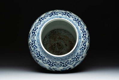 A large Chinese blue and white 'birds among blossoming branches' vase and cover, 19th C.