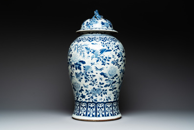 A large Chinese blue and white 'birds among blossoming branches' vase and cover, 19th C.