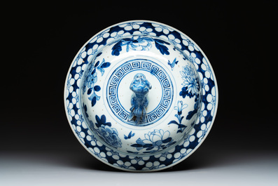 A large Chinese blue and white 'birds among blossoming branches' vase and cover, 19th C.