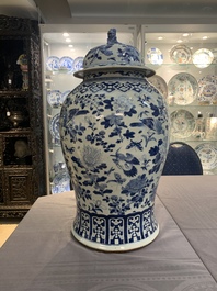 A large Chinese blue and white 'birds among blossoming branches' vase and cover, 19th C.