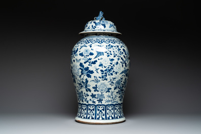 A large Chinese blue and white 'birds among blossoming branches' vase and cover, 19th C.