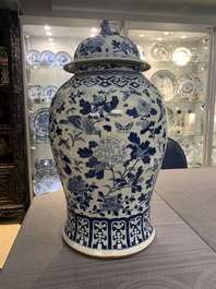 A large Chinese blue and white 'birds among blossoming branches' vase and cover, 19th C.