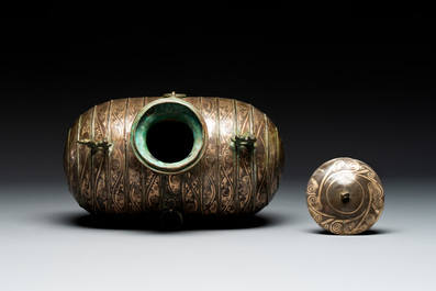 Two large Chinese archaistic bronze rhino- and melon-form vessels, 20th C.