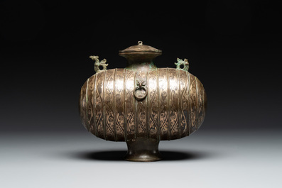 Two large Chinese archaistic bronze rhino- and melon-form vessels, 20th C.