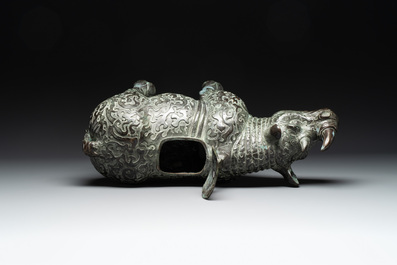 Two large Chinese archaistic bronze rhino- and melon-form vessels, 20th C.