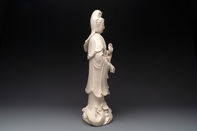 A large Chinese Dehua blanc de Chine Guanyin with a ruyi, 20th C.