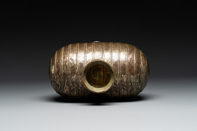 Two large Chinese archaistic bronze rhino- and melon-form vessels, 20th C.