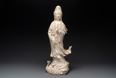 A large Chinese Dehua blanc de Chine Guanyin with a ruyi, 20th C.