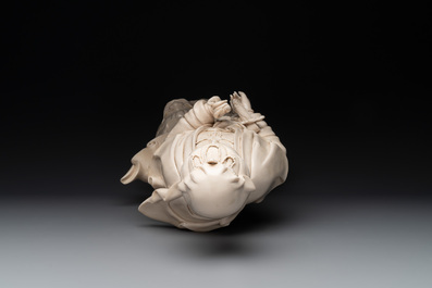 A large Chinese Dehua blanc de Chine Guanyin with a ruyi, 20th C.