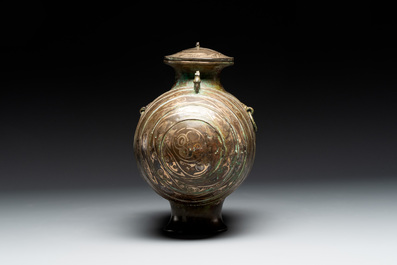 Two large Chinese archaistic bronze rhino- and melon-form vessels, 20th C.