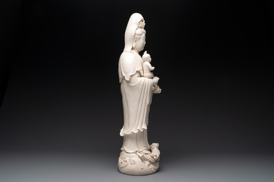 A large Chinese Dehua blanc de Chine group of a Bodhisattva with child, 20th C.