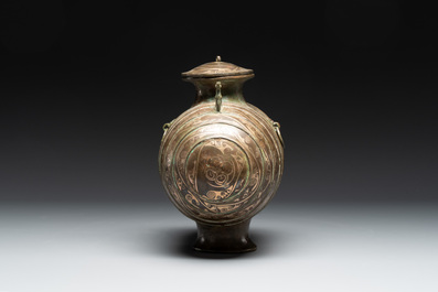 Two large Chinese archaistic bronze rhino- and melon-form vessels, 20th C.
