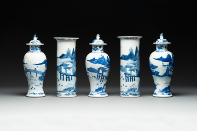 A Chinese blue and white garniture of five vases with river landscapes, 19th C.