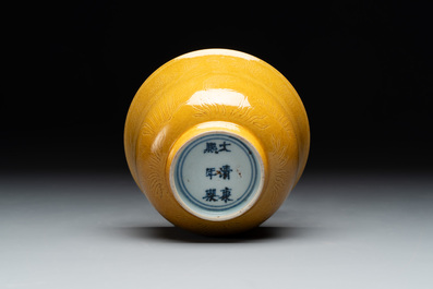A Chinese yellow-glazed 'anhua' 'carp and lotus' bowl, Kangxi mark, 19th C.