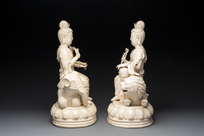 A pair of large Chinese Dehua blanc de Chine Bodhisattvas seated on an elephant and a Buddhist lion, 20th C.