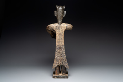 A large Chinese Sanxingdui-style marble sculpture of a standing figure, 20th C.