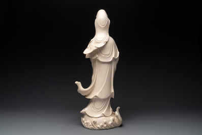 A large Chinese Dehua blanc de Chine Guanyin with a ruyi, 20th C.