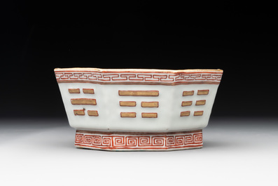 A Chinese iron-red gilt-decorated octagonal 'trigrams' bowl, Tongzhi mark and of the period