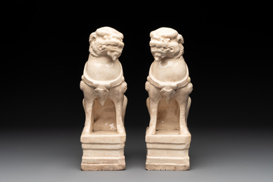 A pair of Chinese white-glazed Buddhist lions, a pair of doves and a pair of iron-red-decorated cranes, Ming and later