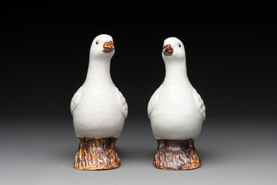A pair of Chinese white-glazed Buddhist lions, a pair of doves and a pair of iron-red-decorated cranes, Ming and later