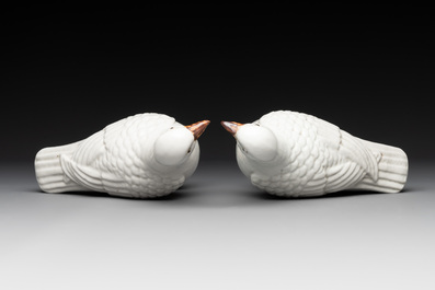 A pair of Chinese white-glazed Buddhist lions, a pair of doves and a pair of iron-red-decorated cranes, Ming and later
