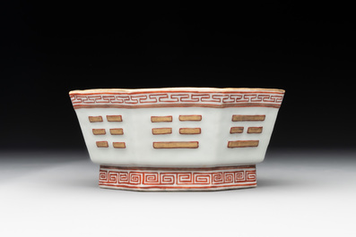 A Chinese iron-red gilt-decorated octagonal 'trigrams' bowl, Tongzhi mark and of the period