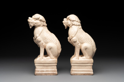 A pair of Chinese white-glazed Buddhist lions, a pair of doves and a pair of iron-red-decorated cranes, Ming and later