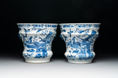 A pair of Chinese blue and white 'birds among flowering branches' jardini&egrave;res, 19th C.