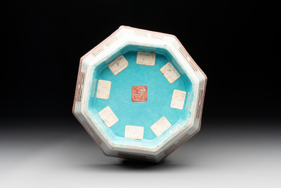 A Chinese iron-red gilt-decorated octagonal 'trigrams' bowl, Tongzhi mark and of the period