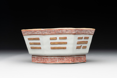 A Chinese iron-red gilt-decorated octagonal 'trigrams' bowl, Tongzhi mark and of the period