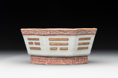 A Chinese iron-red gilt-decorated octagonal 'trigrams' bowl, Tongzhi mark and of the period