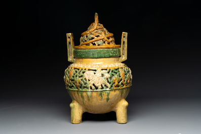 A Chinese sancai-glazed reticulated double-walled tripod censer and cover, Ming