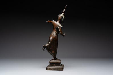 A large Vietnamese copper- and silver-inlaid bronze sculpture of a dancer, Bien Hoa school, early 20th C.