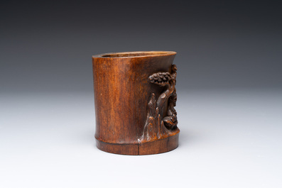 A varied collection of three Chinese brush pots, two sculptures, a lacquered covered box and a marble-inlaid wooden table screen, 20th C.