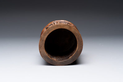 A varied collection of three Chinese brush pots, two sculptures, a lacquered covered box and a marble-inlaid wooden table screen, 20th C.