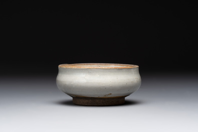 A Chinese 'jun' bowl and a Dehua blanc de Chine group with Guanyin, Ming/Qing