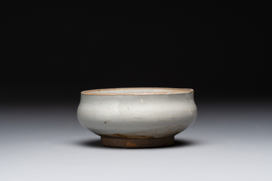 A Chinese 'jun' bowl and a Dehua blanc de Chine group with Guanyin, Ming/Qing