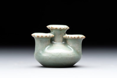 A small and rare Chinese Longquan celadon quadruple-neck vase, Song/Yuan