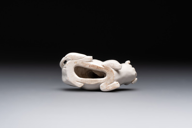 A Chinese 'jun' bowl and a Dehua blanc de Chine group with Guanyin, Ming/Qing